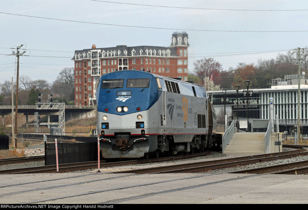 AMTK 46 leads train P080-16 away from the station